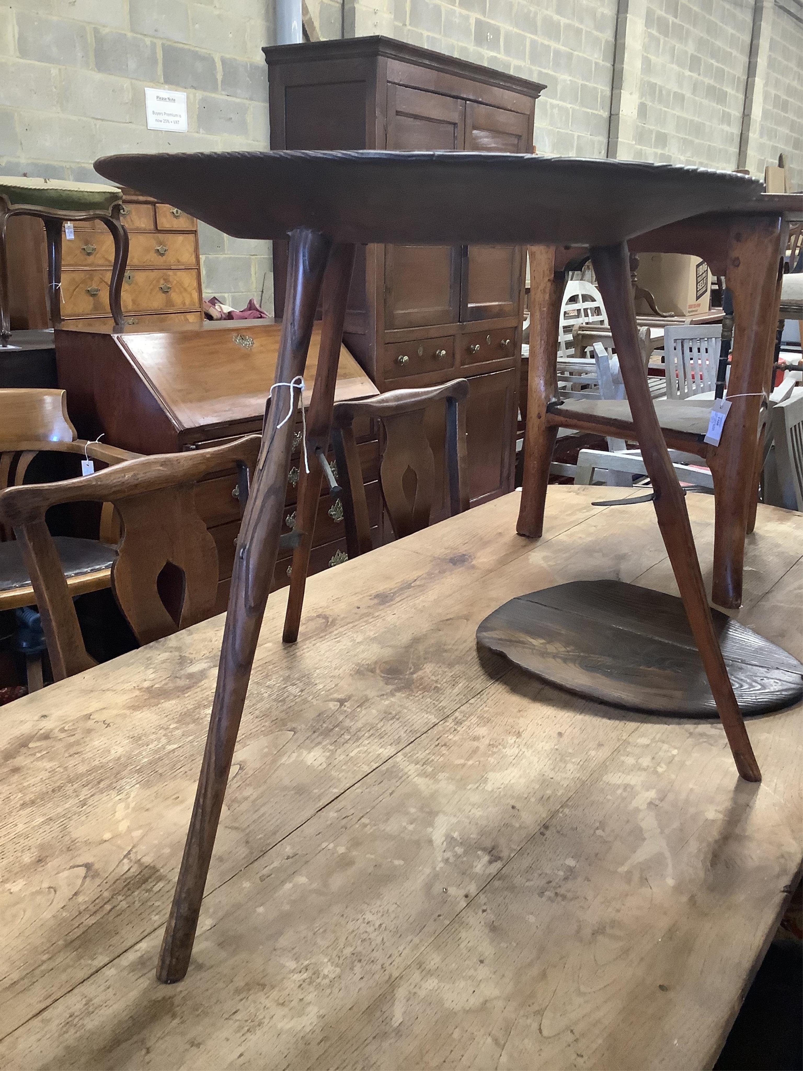 An unusual 18th century weathered elm cricket table, width 61cm, height 60cm. Condition - fair to good